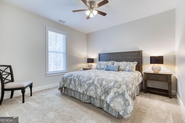 bedroom with ceiling fan, carpet, visible vents, and baseboards