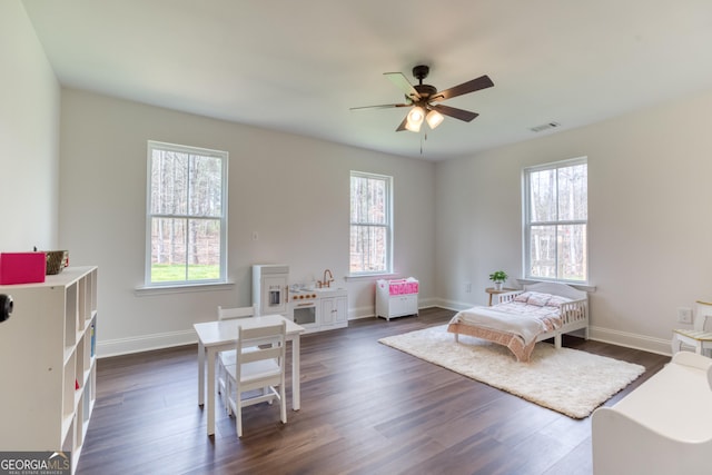 interior space featuring dark wood-style flooring and a healthy amount of sunlight