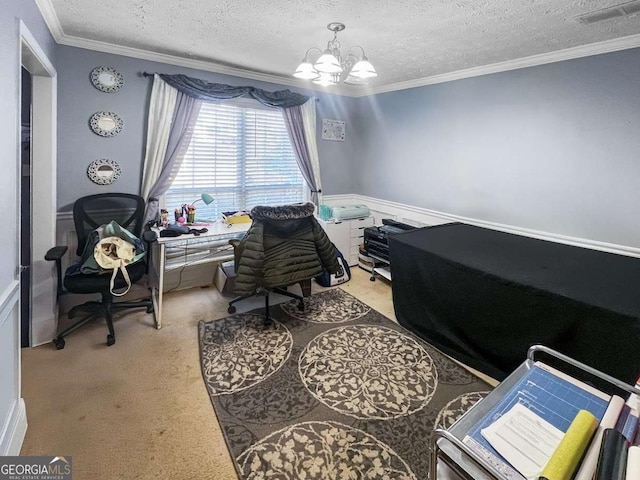 office with visible vents, light colored carpet, a wainscoted wall, crown molding, and a textured ceiling