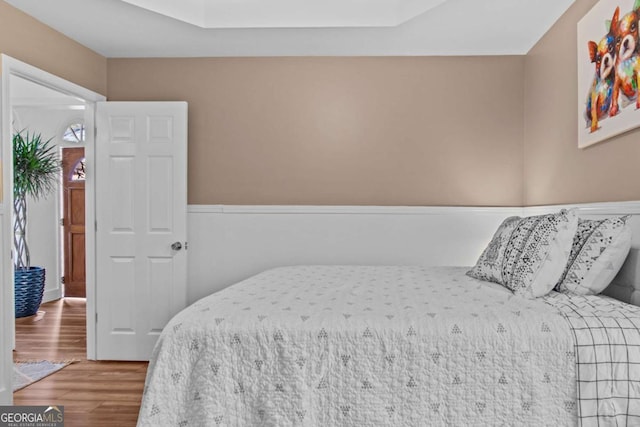 bedroom featuring wood finished floors