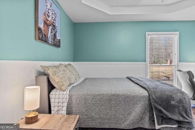 bedroom with a raised ceiling