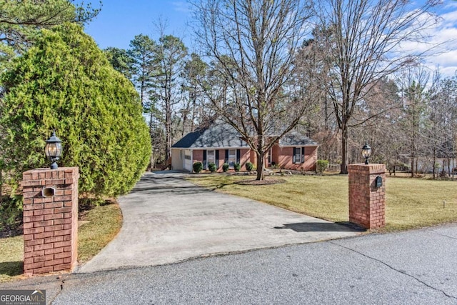 single story home with aphalt driveway and a front lawn