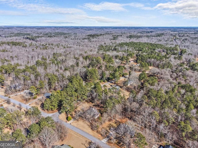 aerial view with a wooded view