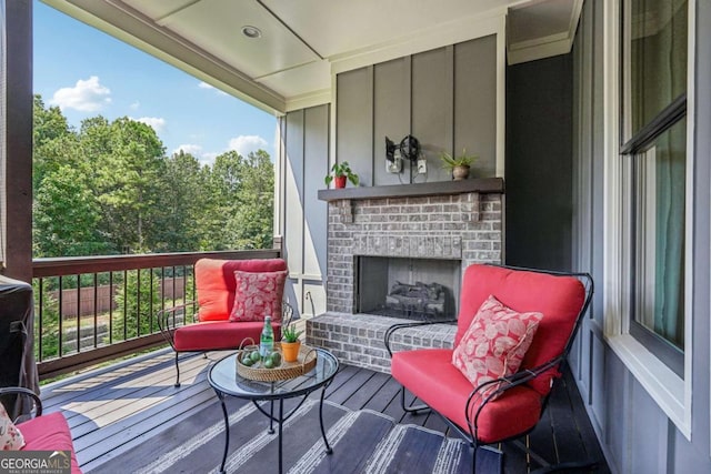 deck with a brick fireplace