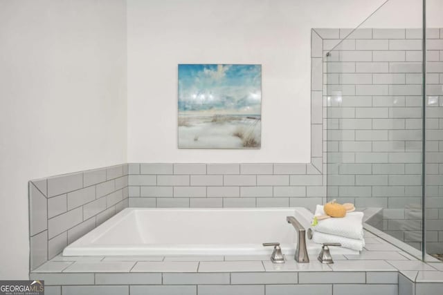 bathroom featuring a garden tub