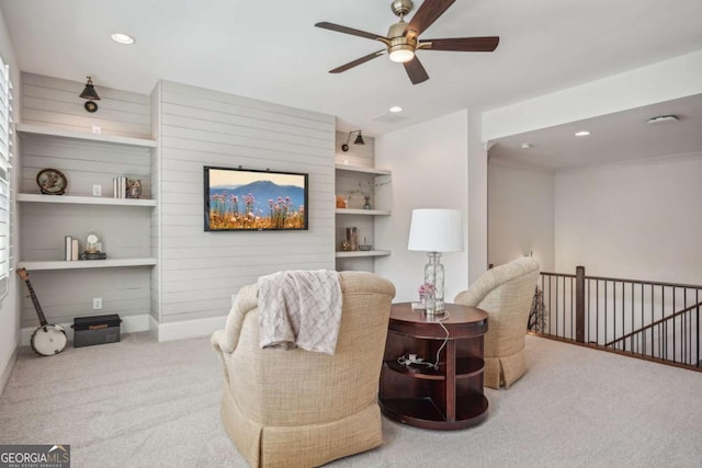 sitting room with recessed lighting, carpet flooring, a ceiling fan, baseboards, and an upstairs landing