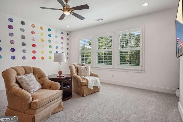 living area featuring carpet, visible vents, baseboards, and recessed lighting