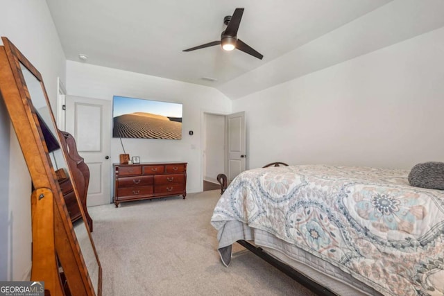 bedroom featuring light carpet, vaulted ceiling, and a ceiling fan