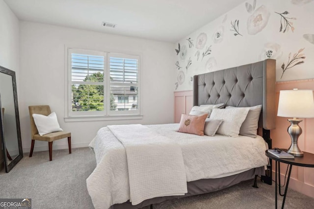 carpeted bedroom with baseboards and visible vents