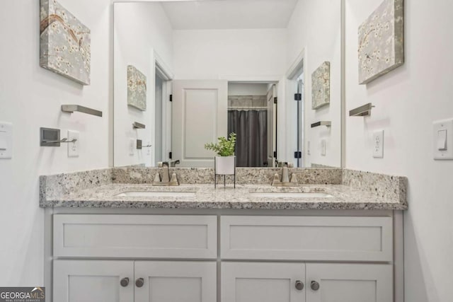 bathroom with double vanity and a sink