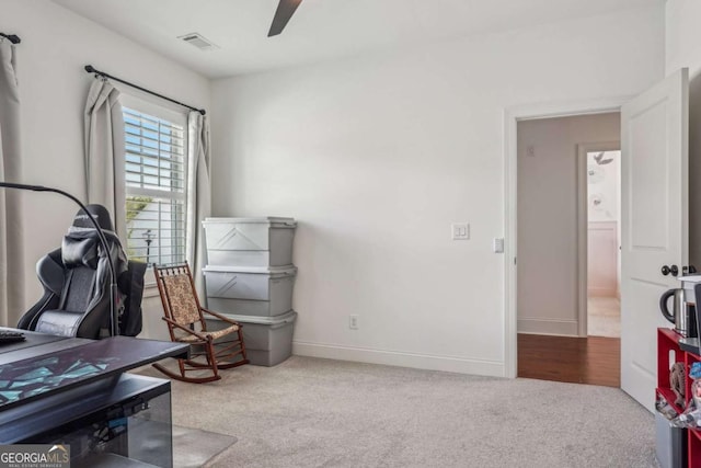 miscellaneous room featuring a ceiling fan, carpet flooring, visible vents, and baseboards