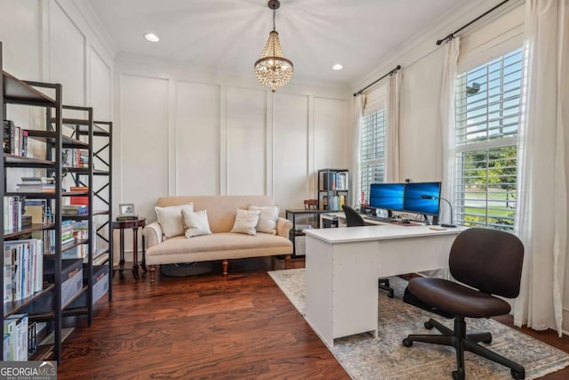 office with dark wood-style flooring, recessed lighting, a decorative wall, ornamental molding, and a chandelier