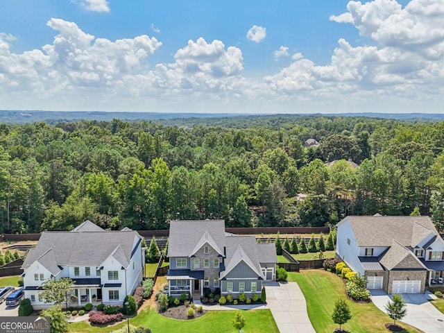 aerial view featuring a wooded view