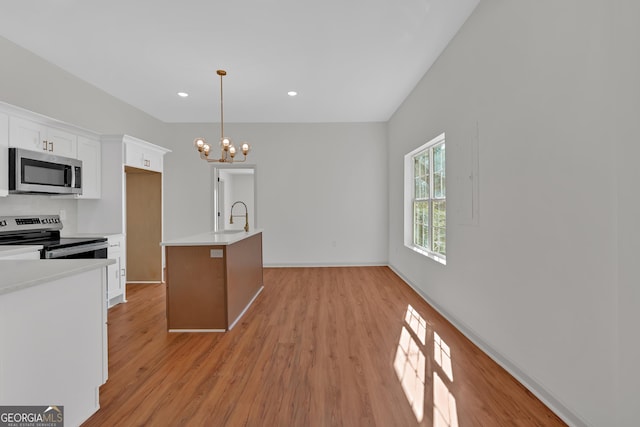 436 Tarpley Ave, Bowdon, GA 30108 - kitchen featuring appliances with stainless steel finishes, white cabinetry, a chandelier, a sink, and light countertops