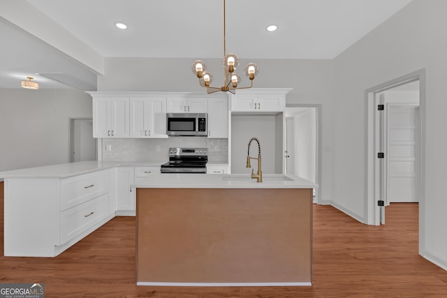 436 Tarpley Ave, Bowdon, GA 30108 - kitchen with stainless steel appliances, backsplash, a sink, light countertops, and recessed lighting