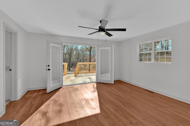 436 Tarpley Ave, Bowdon, GA 30108 - empty room with plenty of natural light, wood finished floors, and baseboards