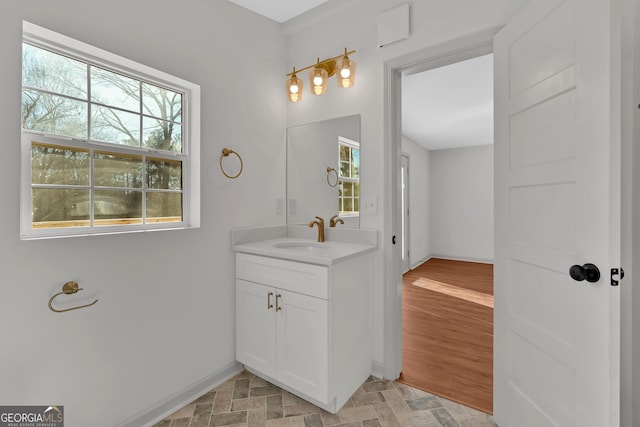 436 Tarpley Ave, Bowdon, GA 30108 - bathroom with vanity, plenty of natural light, and baseboards