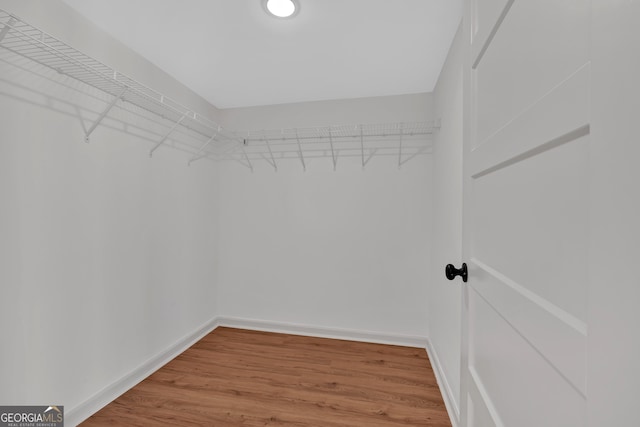 436 Tarpley Ave, Bowdon, GA 30108 - walk in closet featuring wood finished floors