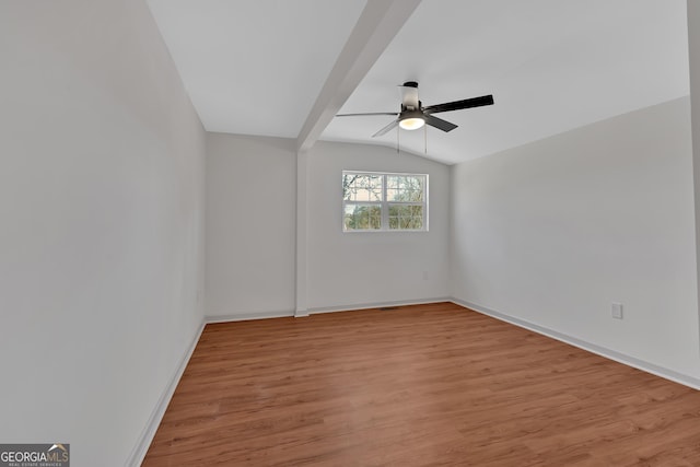 436 Tarpley Ave, Bowdon, GA 30108 - spare room featuring ceiling fan, light wood-style flooring, vaulted ceiling, and baseboards