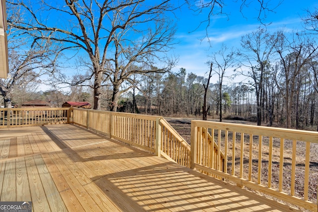 436 Tarpley Ave, Bowdon, GA 30108 - wooden terrace with view of wooded area