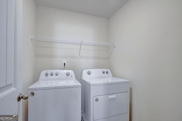 washroom with laundry area and washer and clothes dryer