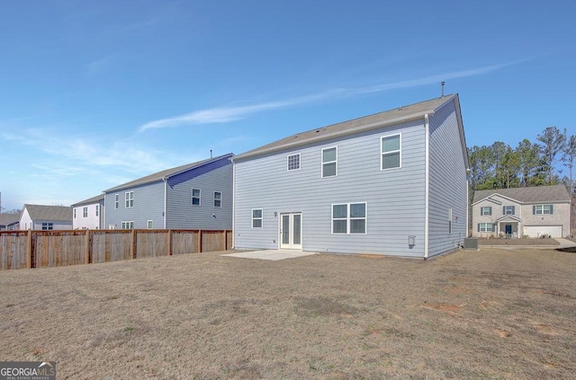 back of house featuring french doors, central AC unit, and fence