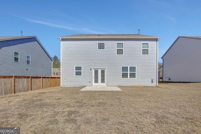 back of house with a patio area, fence, and a yard