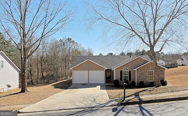 ranch-style house with driveway, stone siding, and a garage