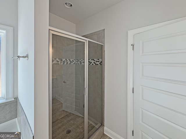 bathroom with a stall shower