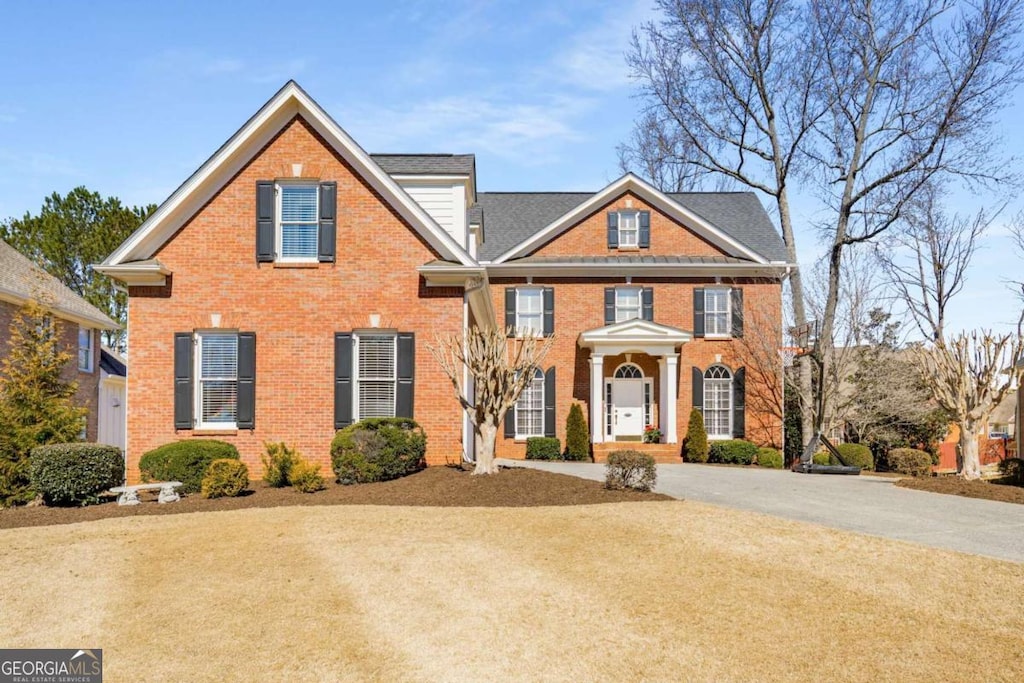 view of front of home featuring brick siding