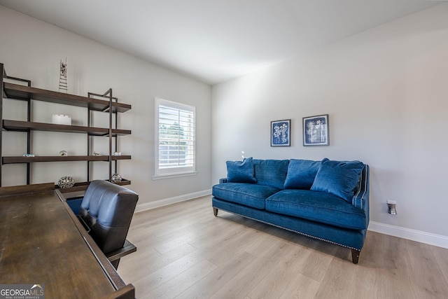 office area with wood finished floors and baseboards