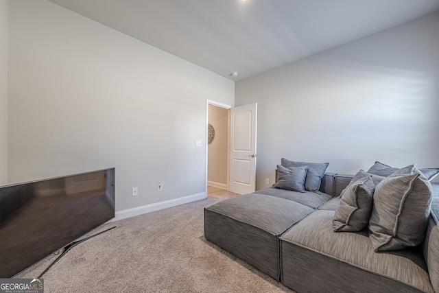 bedroom with carpet floors and baseboards