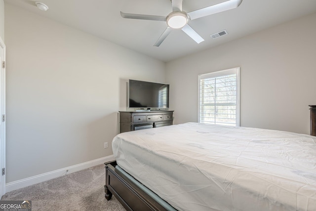 bedroom with a ceiling fan, baseboards, visible vents, and carpet flooring