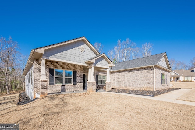 view of front facade featuring brick siding