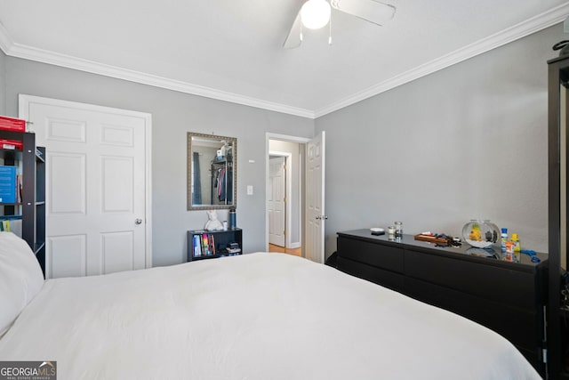 bedroom featuring crown molding and ceiling fan