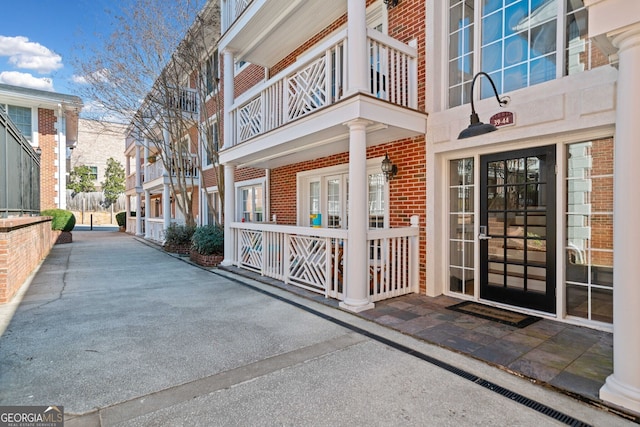 property entrance with brick siding