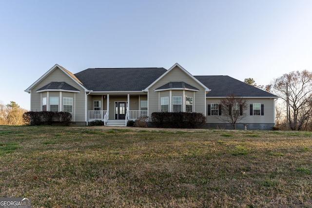 single story home featuring crawl space, covered porch, and a front lawn