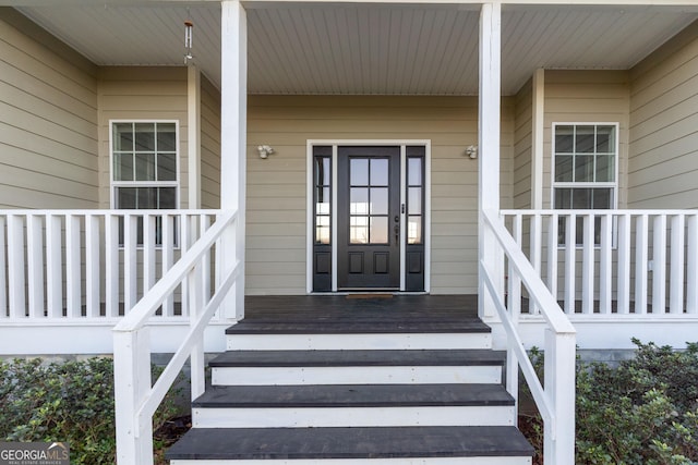 entrance to property featuring covered porch