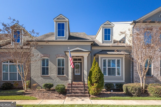 view of front of home featuring brick siding