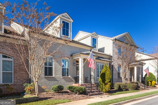 view of front of home featuring brick siding