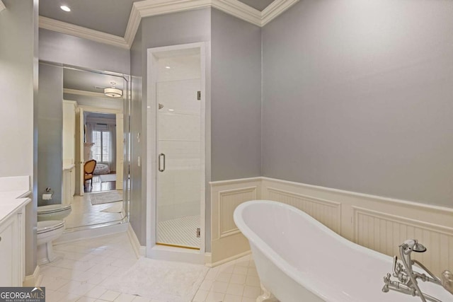 full bath with toilet, a wainscoted wall, vanity, ornamental molding, and a stall shower