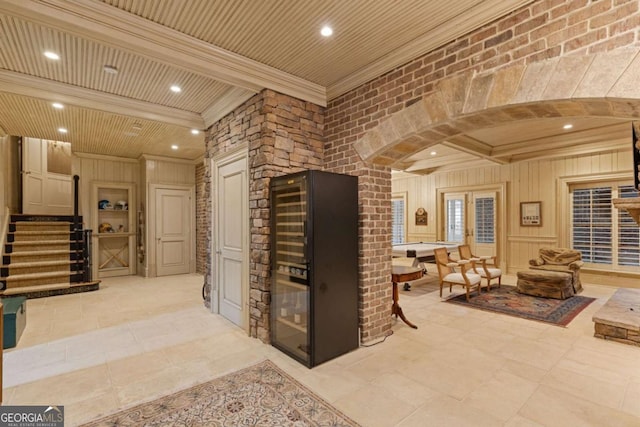 wine area with wooden ceiling, tile patterned floors, crown molding, and recessed lighting