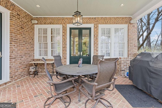 view of patio / terrace featuring a grill and french doors