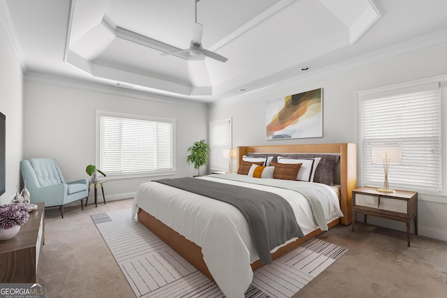 bedroom with ornamental molding, carpet, a raised ceiling, and baseboards