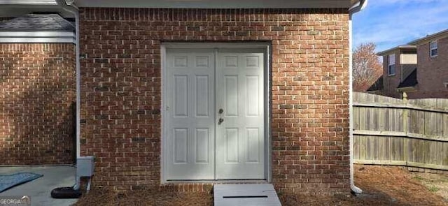 2477 Misty Rose Ln, Loganville, GA 30052 - entrance to property featuring fence and brick siding
