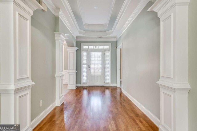 2477 Misty Rose Ln, Loganville, GA 30052 - foyer entrance with ornamental molding, decorative columns, baseboards, and wood finished floors