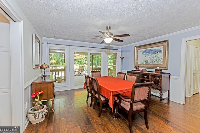 dining room with crown molding, a textured ceiling, ceiling fan, and dark wood-type flooring