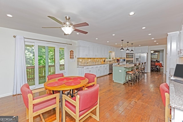 dining area featuring a ceiling fan, recessed lighting, and light wood-style flooring