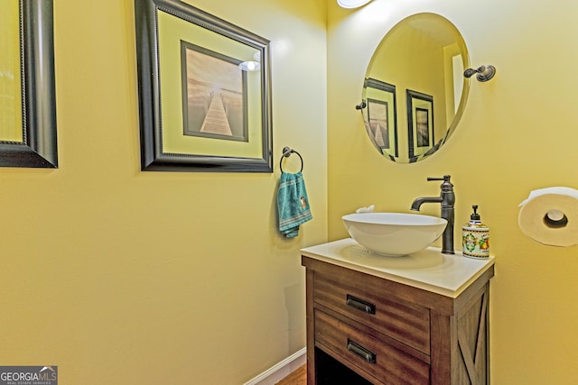 bathroom featuring baseboards and vanity