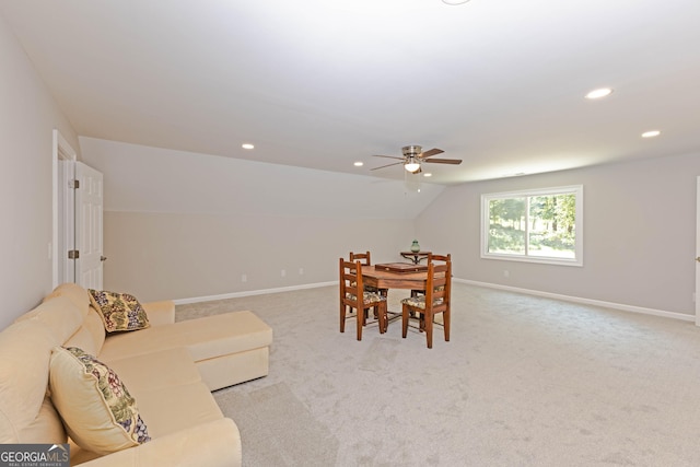 dining area with recessed lighting, baseboards, vaulted ceiling, and light colored carpet